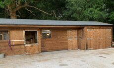 L' shaped stable with storage