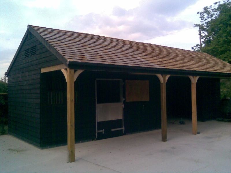 Custom Made Stable Block, Black With Cedar Shingle Tile Roof