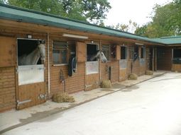 Commercial Stable Block With Green Tile Effect Roof